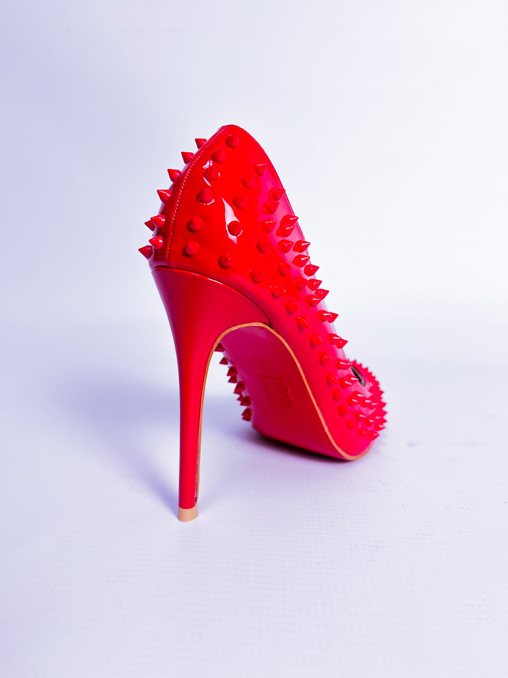 Red Spiked Patent Leather Stiletto Pump