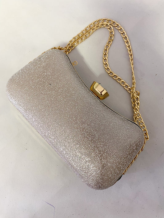 elevated golden handbag